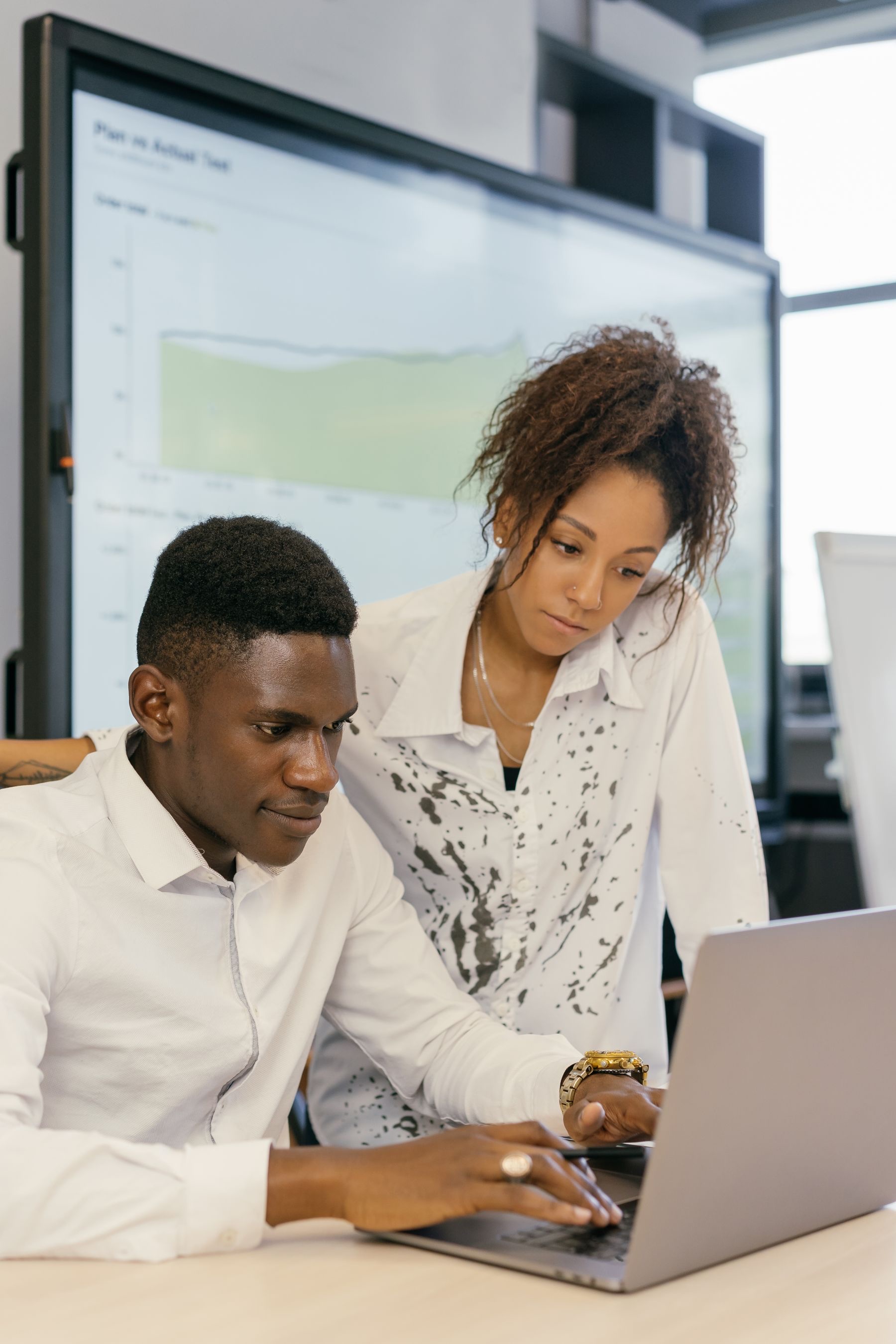 Two colleagues working together on a software project