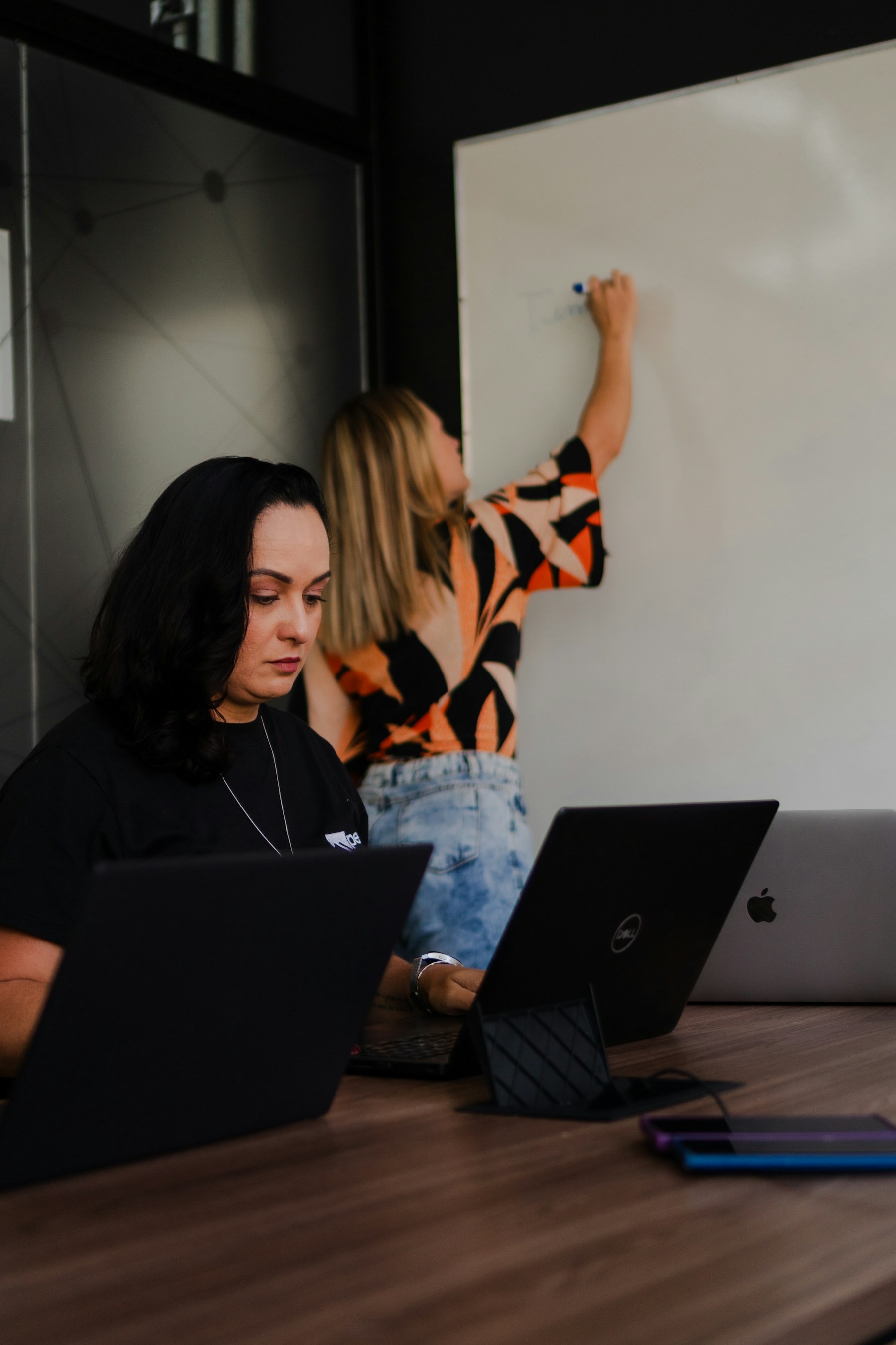 Product team planning a software workflow at a whiteboard